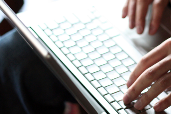 Hands using a laptop